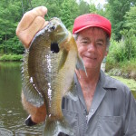 Its hot, yes I am wet with sweat, but this bluegill put a smile on my face