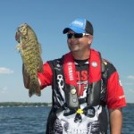 Jeremy with smallmouth bass that hit a vibrating jig