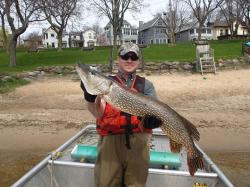 David Rowe holds a northern pike 