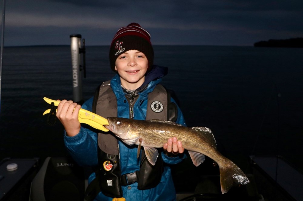 happy kid with walleye